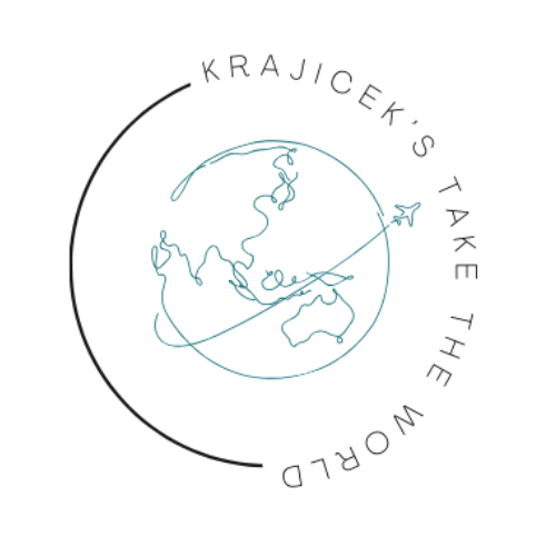 A group of travelers enjoying their time at a scenic viewpoint, with mountains and greenery in the background, showcasing the beauty of Peru.